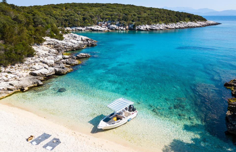 The depth of the water and the type of sand can make a difference to how blue it is