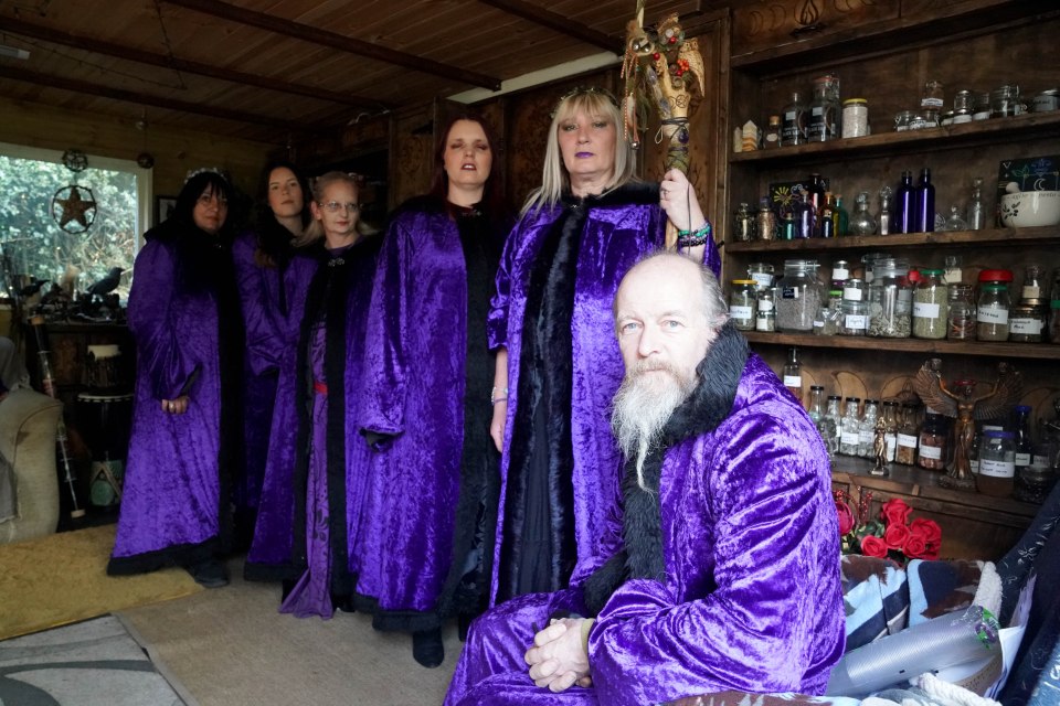 Julie, pictured with her coven, who will be taking part in the ritual for King Charles