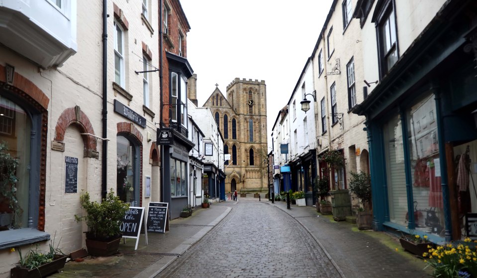 A row of quaint shops leading down to Ripon Cathedral