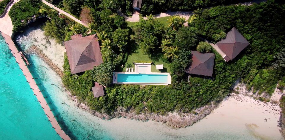 The tropical paradise boasts 11 bedrooms, 12 bathrooms and four guest houses