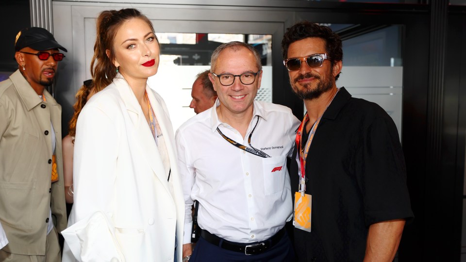 Maria Sharapova and Orlando Bloom pose alongside Stefano Domenicali