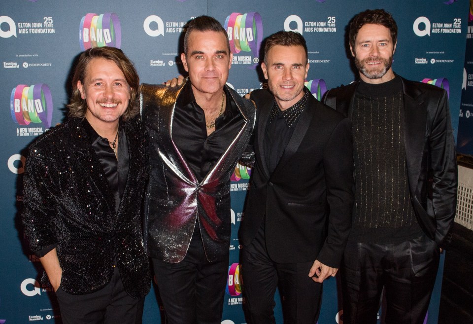 Robbie pictured band mates in 2018