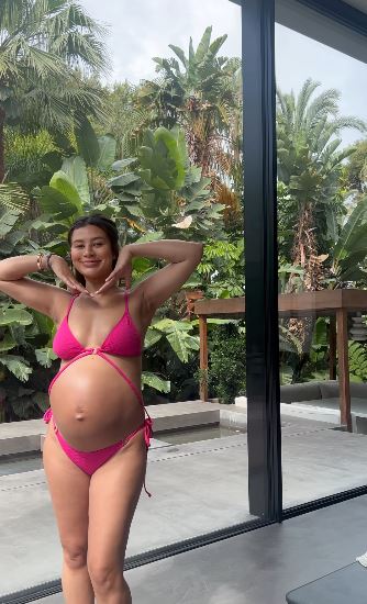 Montana Brown displayed her huge baby bump in a pink bikini