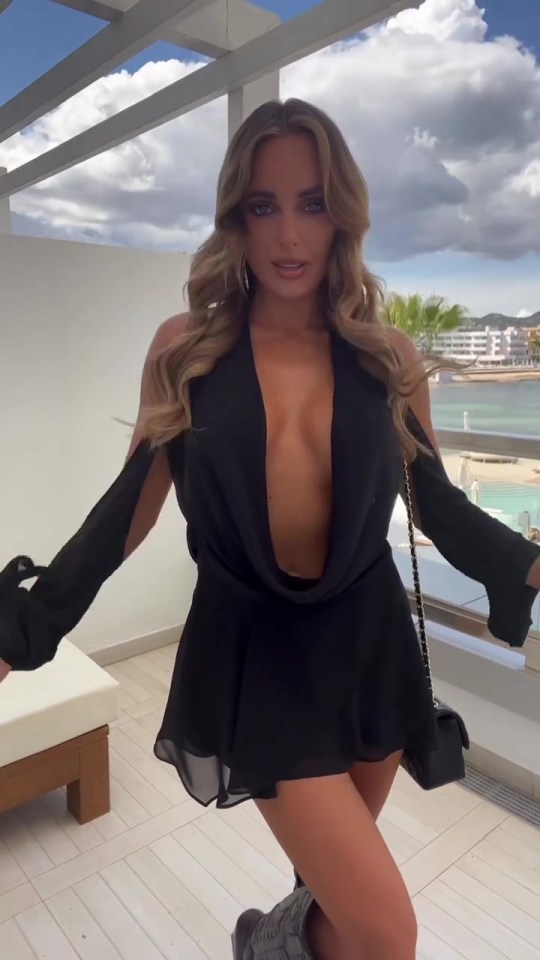 Newly single Amber Turner looked sensational in a flirty black dress in Ibiza