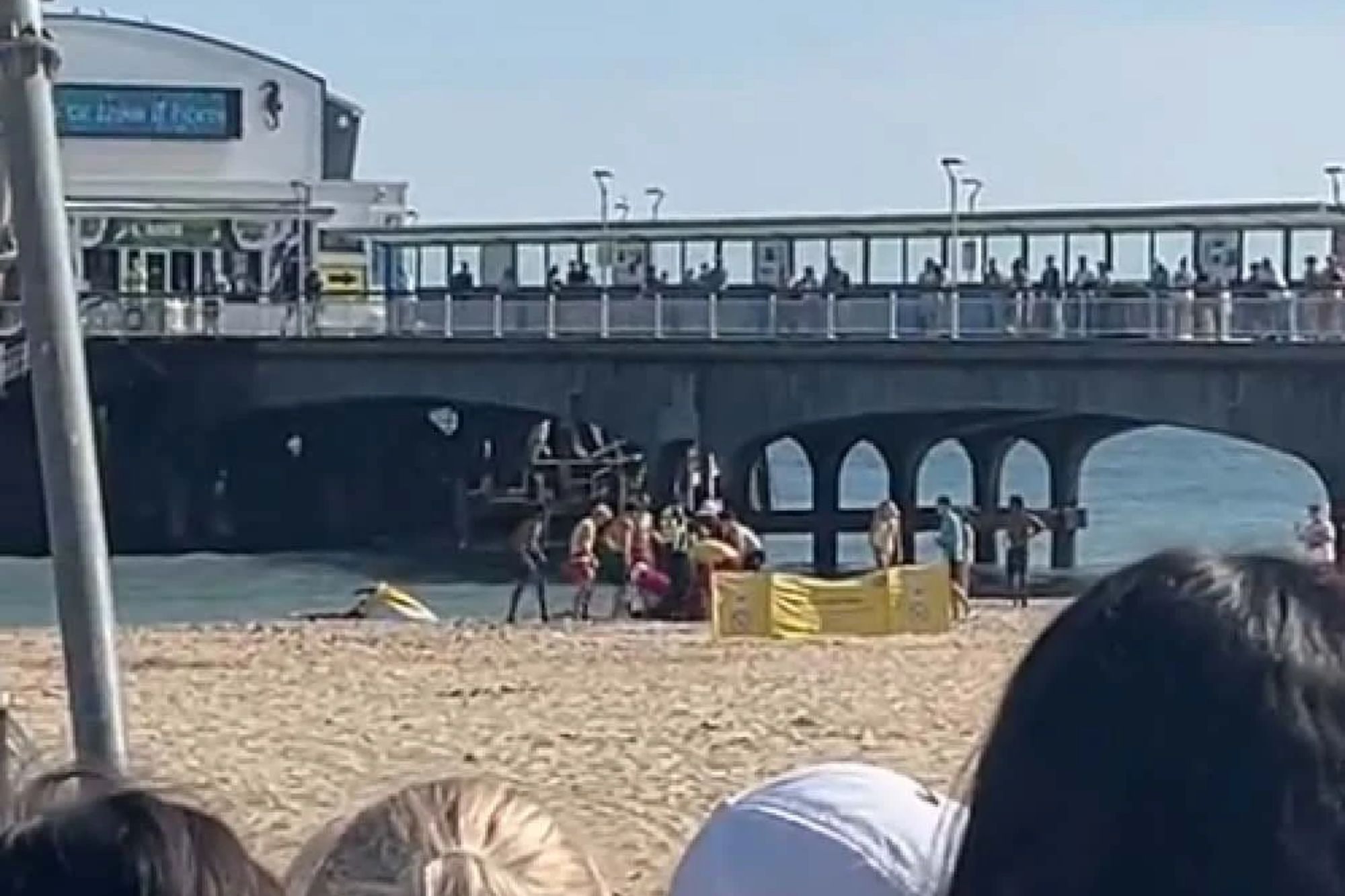 A man in his 40s has been arrested on suspicion of manslaughter after the horror on East Beach