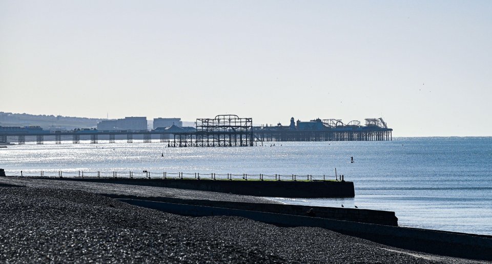 The ruined remnants of Brighton's West Pier, opened in 1866 but closed in 1975, can be seen in the sea - damaged by storms and a suspected arson attack in 2003