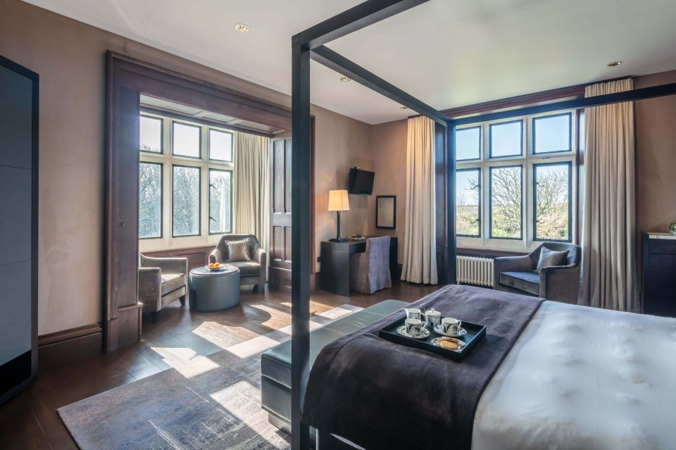 There are six huge bedrooms which feature plush suede wallpaper and wooden panelling