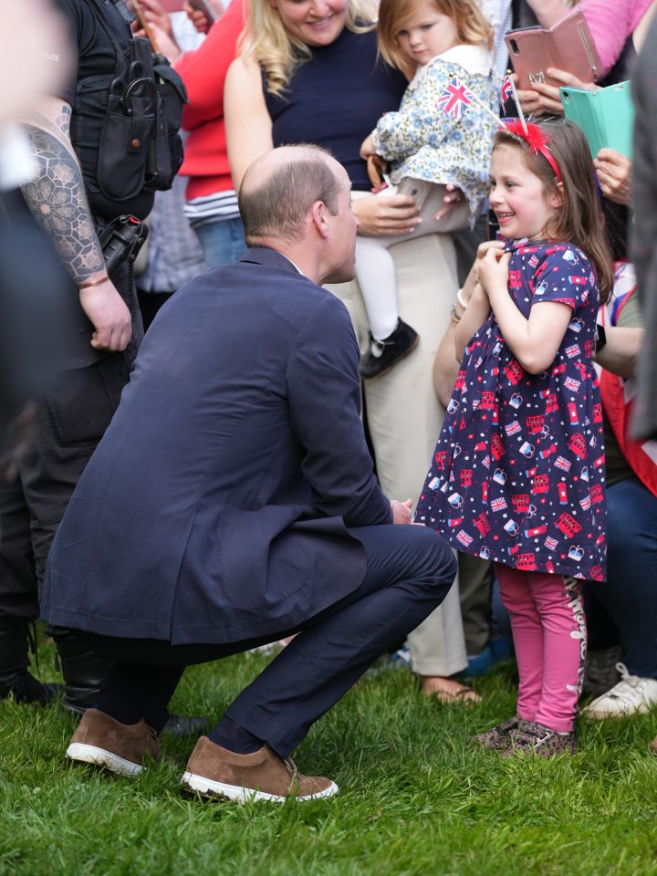 William was seen speaking to the same young girl Kate consoled after she brightened up