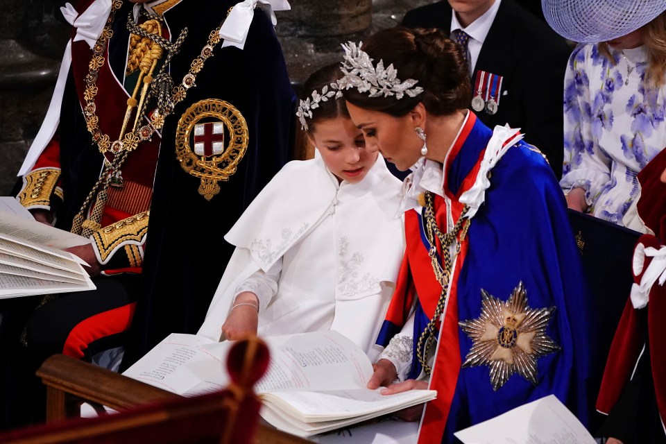 She and daughter Charlotte twinned with ornate headpieces