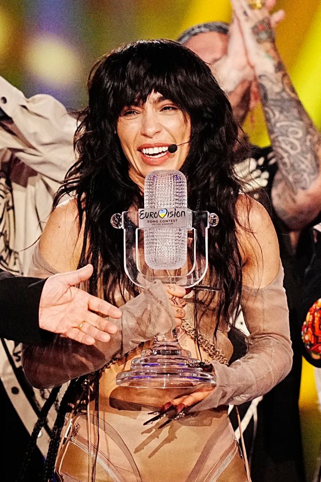 Sweden's Loreen holds the Eurovision trophy after winning Saturday night's contest