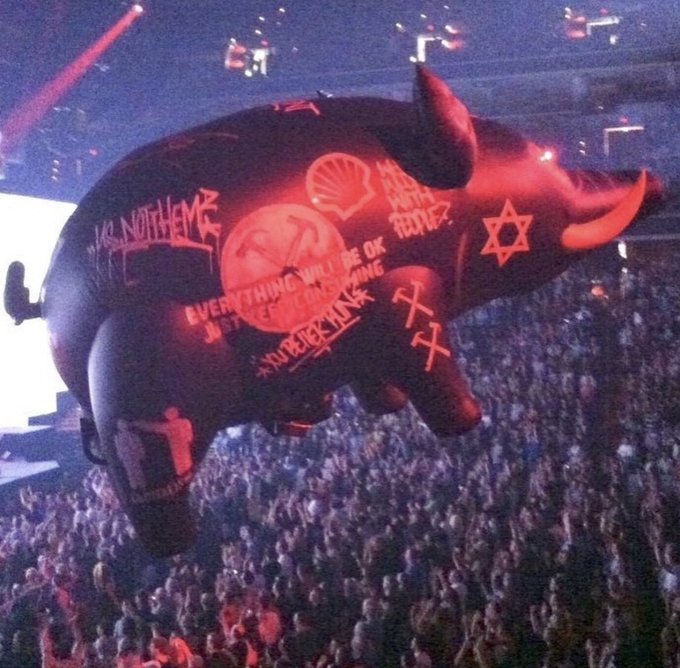 An inflatable pig bearing the Star of David floated above