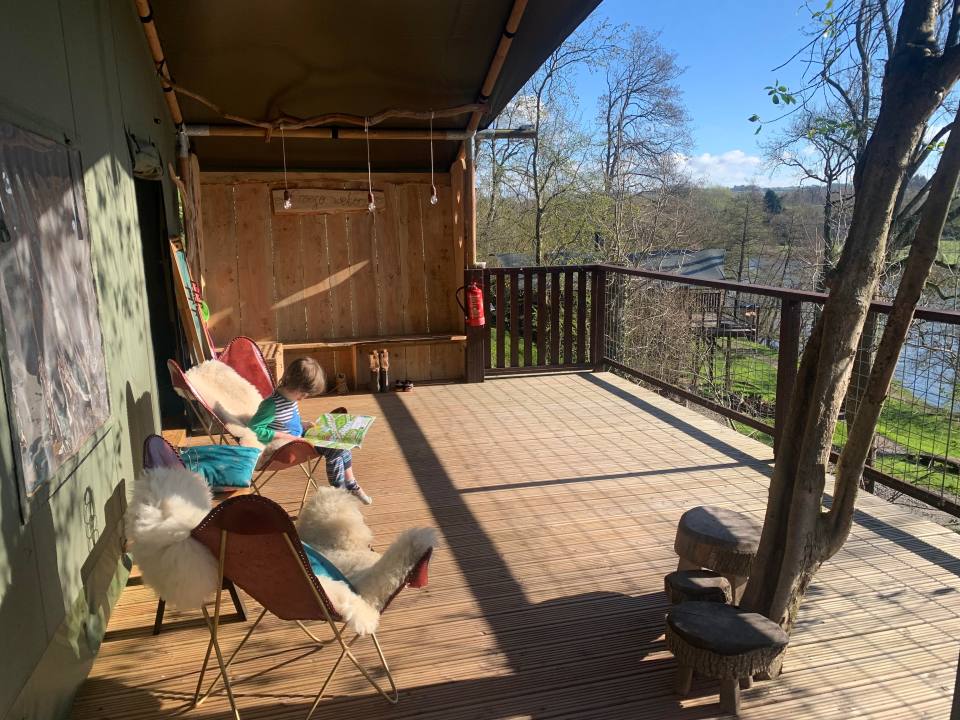 Caroline's son basked in the morning sun on deck while reading up about local bugs and birds