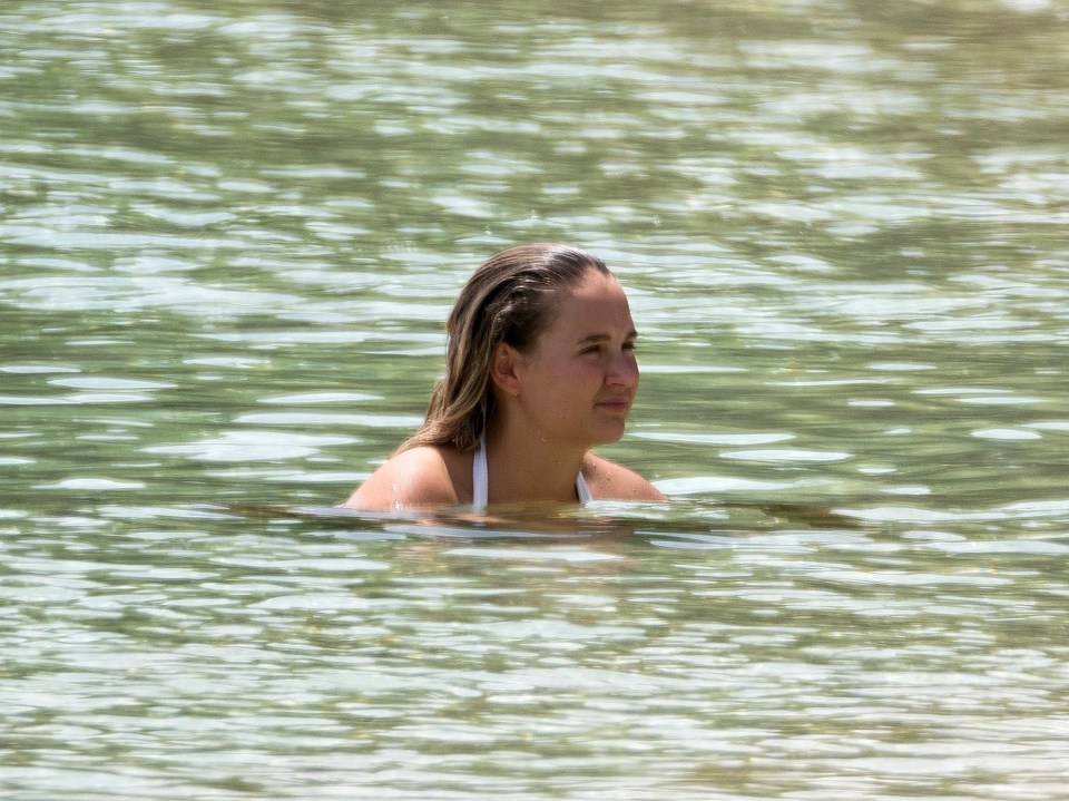 The mum-of-one cooled off in the sea with a swim