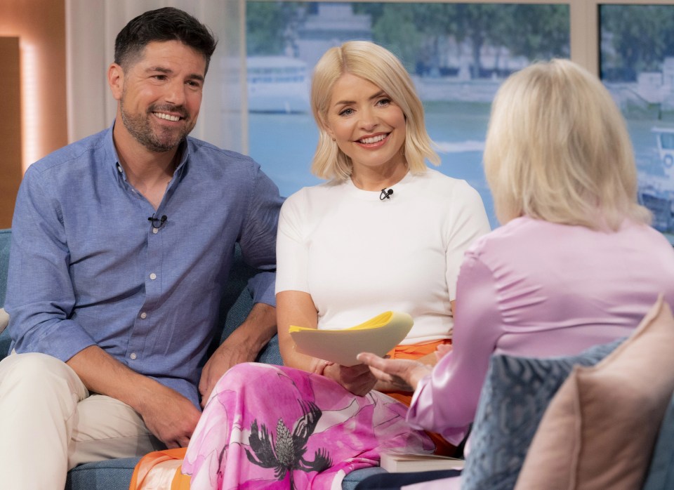 Holly and Craig Doyle, seen here with Sue Barker, fronted today's This Morning