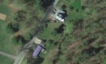 A satellite view of the garage, the small structure to the right of the blue property.