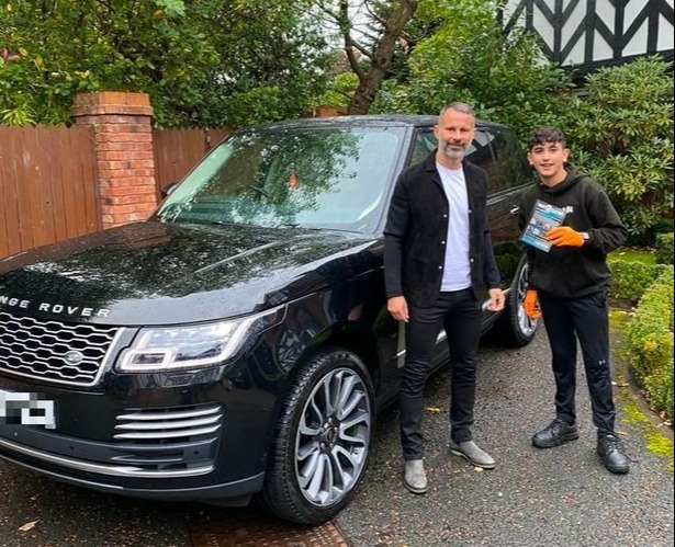 Manchester United legend Ryan Giggs appears happy with the shine on his Range Rover