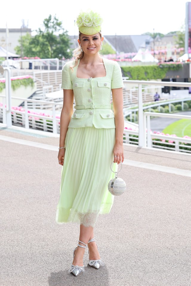 This guest looked pretty in pastel as she arrived for the day of racing