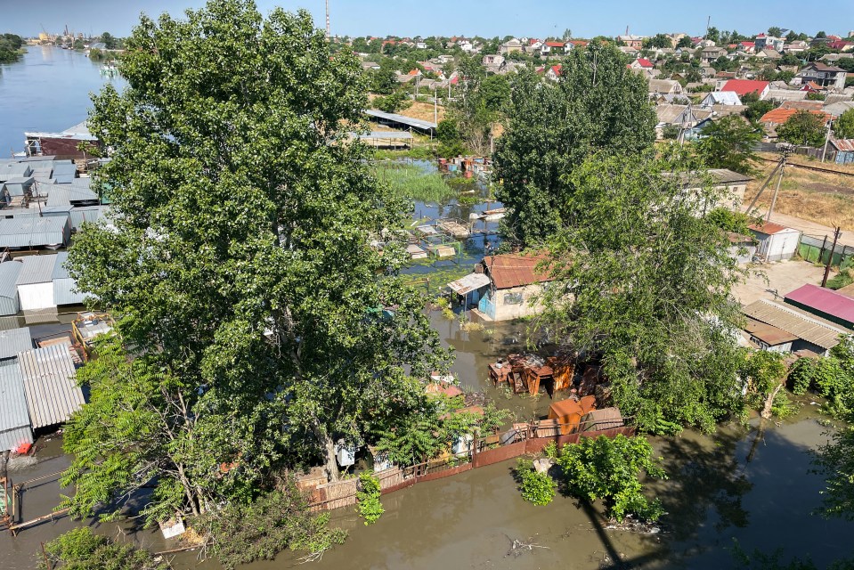 Flooding is building up as the river is overwhelmed by the water from the dam