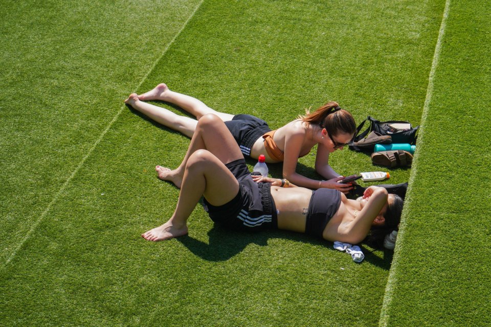 Sunbathers relax in Granary Square, London yesterday - with more warm weather forecast for today