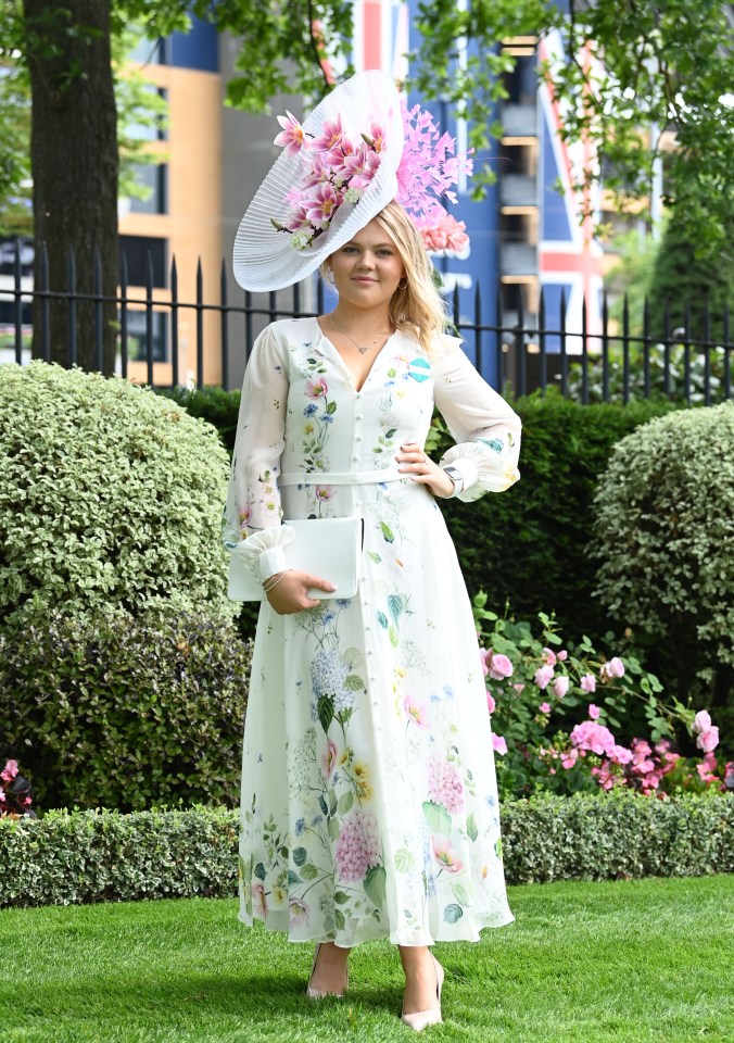 This woman looked fabulous in florals, with an eye-catching orchid-themed headpiece