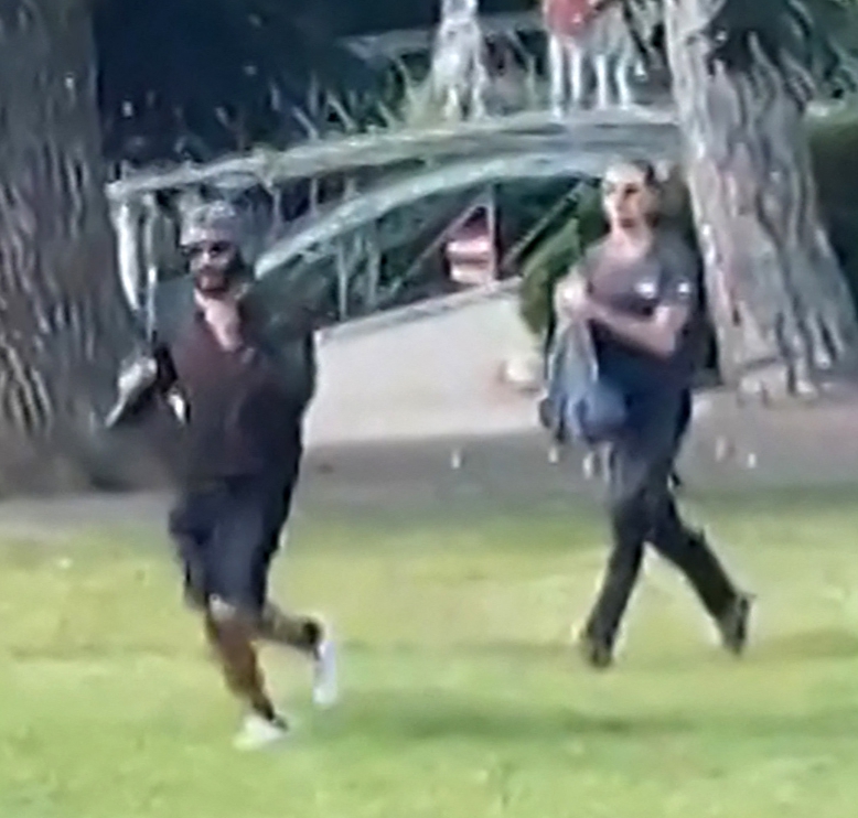 The attacker being chased by Henri d'Ansleme - dubbed 'backpack hero'