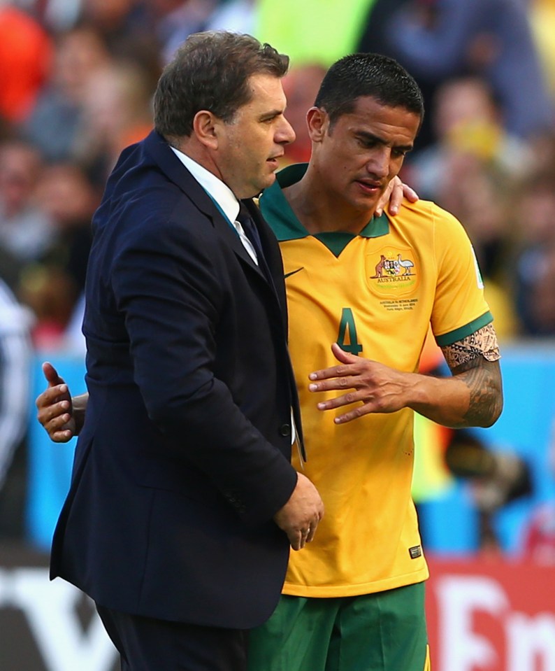 PORTO ALEGRE, BRAZIL - JUNE 18: Tim Cahill of Australia hugs head coach Ange Postecoglou after exiting the game during the 2014 FIFA World Cup Brazil Group B match between Australia and Netherlands at Estadio Beira-Rio on June 18, 2014 in Porto Alegre, Brazil. (Photo by Cameron Spencer/Getty Images)