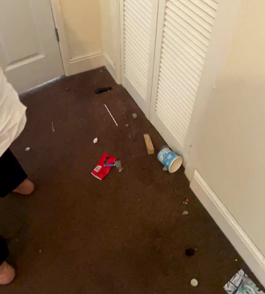 Rubbish, including a cigarette packet and food wrappers, was scattered across the floor