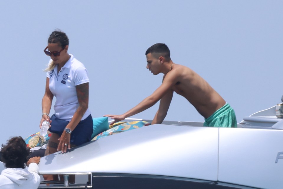 Junior was first seen sporting blue floral swim shorts, but he later changed into a turquoise pair