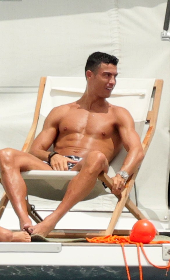 EXCLUSIVE: **USE CHILD PIXELATED IMAGES IF YOUR TERRITORY REQUIRES IT** Cristiano Ronaldo shows off his ripped physique whilst on holiday in Sardinia, Italy. The footballer was joined by his family and gorgeous girlfriend Georgina Rodriguez, who stunned in a bikini. The couple chilled out on their yacht, soaking in the afternoon sunshine. Pictured: Cristiano Ronaldo Ref: SPL8399115 220623 EXCLUSIVE Picture by: Ciao Pix / SplashNews.com Splash News and Pictures USA: 310-525-5808 UK: 020 8126 1009 eamteam@shutterstock.com World Rights, No Italy Rights