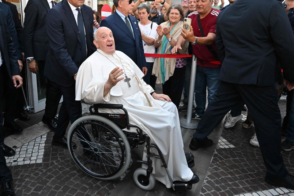 Pope Francis is a roamin’ Catholic as he leaves hospital waving from a wheelchair