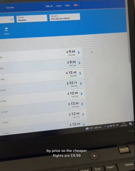 The woman uses the Fare Finder on the Ryanair website to find the best fares