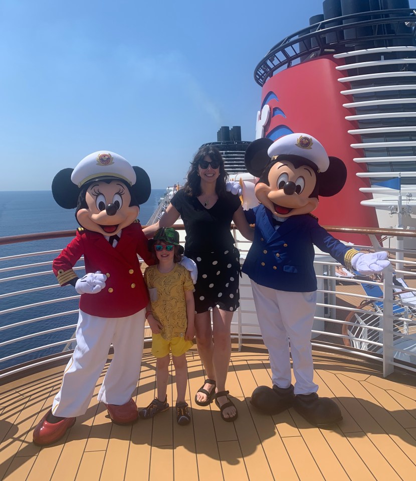 Caroline McGuire with her son on the Disney Cruise Line with their new friends Micky and Minnie