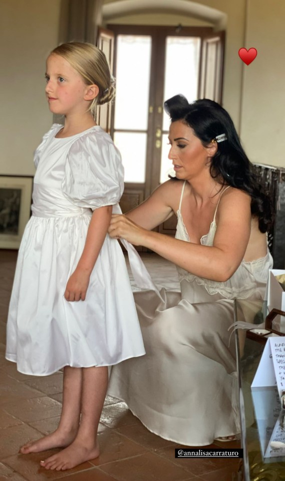 Her mini-me was tended to by a bridesmaid in another snap