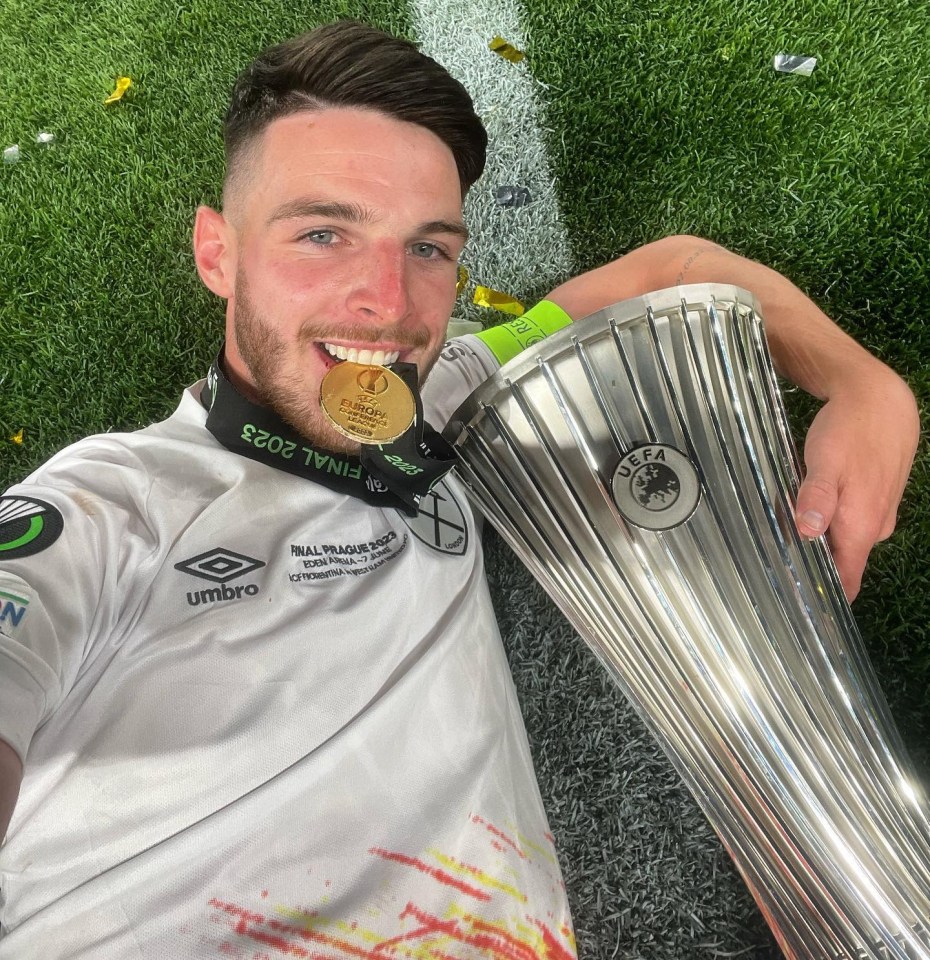 Captain Rice posed on the pitch with the trophy