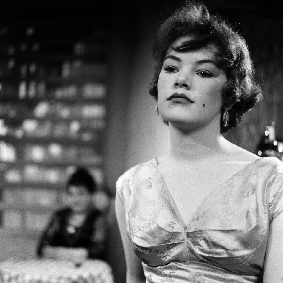 The cast of a new play, 'All Kinds of Men' by Alex Samuels. The play is set in Mme Tina's house of ill fame. Pictured, Glenda Jackson as Rubie. The Arts Theatre, London, 18th September 1957. (Photo by Bela Zola/Mirrorpix/Getty Images)