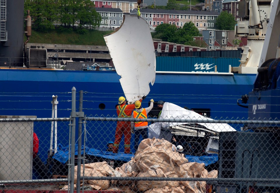 Debris from the Titan submersible, recovered from the ocean floor near the wreck of the Titanic, is unloaded from the ship Horizon Arctic at the Canadian Coast Guard pier in St. John's, Newfoundland, Wednesday, June 28, 2023. (Paul Daly/The Canadian Press via AP)