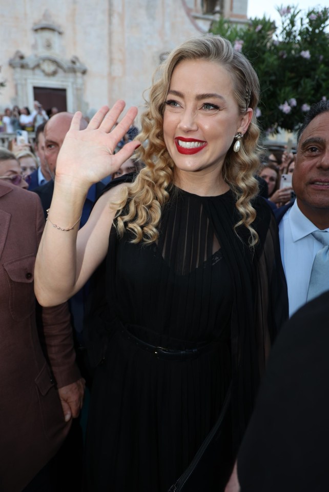 Despite threats to her life, Amber Heard held her head high on the red carpet at the Taormina Film Festival