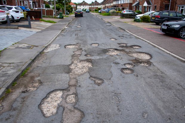 Pothole Crescent the name given to Glebe Crescent at Witham in Essex where residents have had to put up with the appalling road surface for nearly five years...PICTURE BY JOHN McLELLAN - 3.6.23