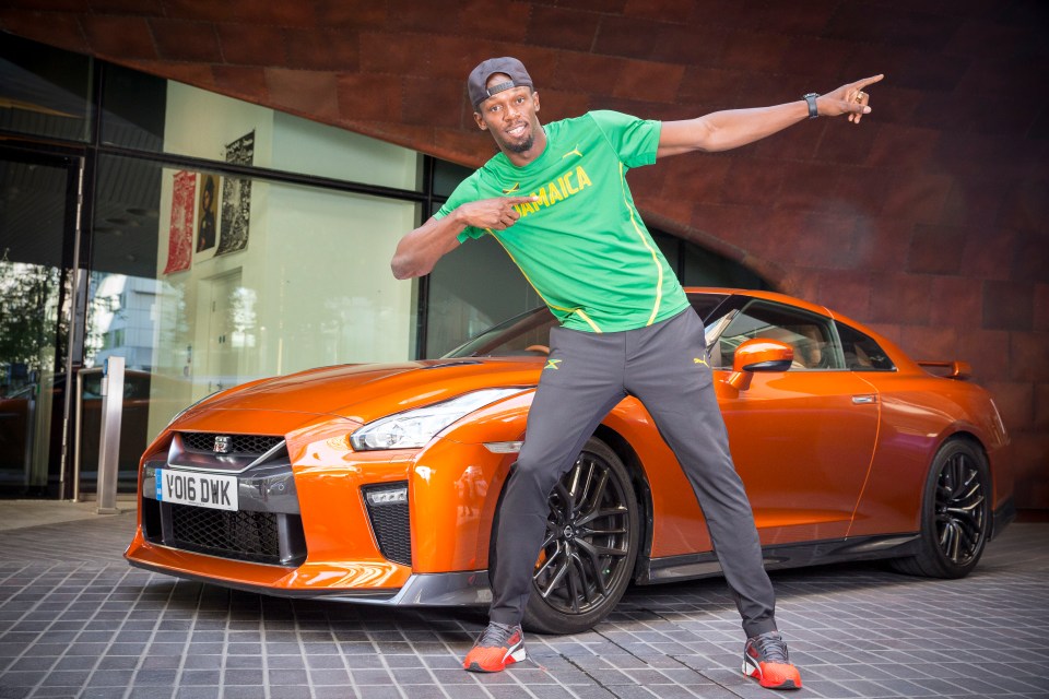 Bolt received a custom gold painted vehicle, but also has posed with the orange model