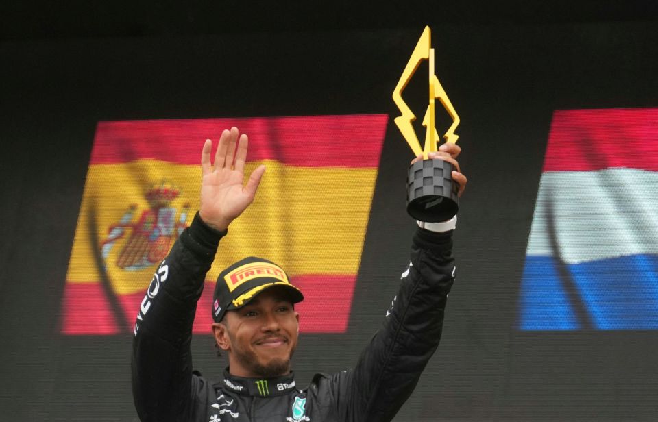 Lewis Hamilton celebrates on the podium at the Canadian GP