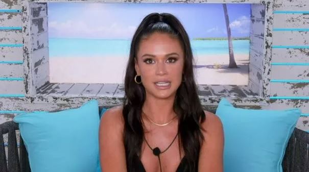 Olivia chatting in the beach hut