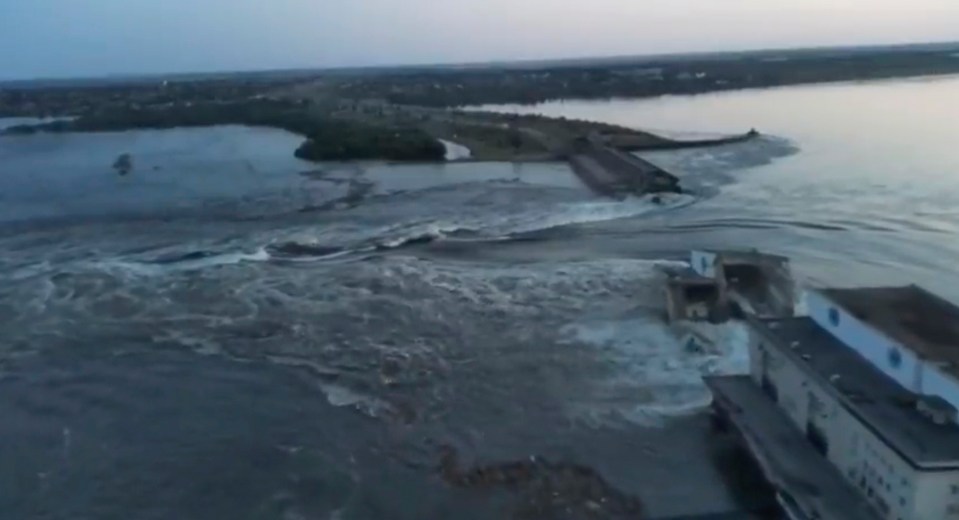 In this image taken from video released by the Ukrainian Presidential Office, water runs through a breakthrough in the Kakhovka dam in Kakhovka, Ukraine, Tuesday, June 6, 2023. Ukraine on Tuesday accused Russian forces of blowing up the major dam and hydroelectric power station in a part of southern Ukraine they control, threatening a massive flood that could displace hundreds of thousands of people, and ordered residents downriver to evacuate. (Ukrainian Presidential Office via AP)