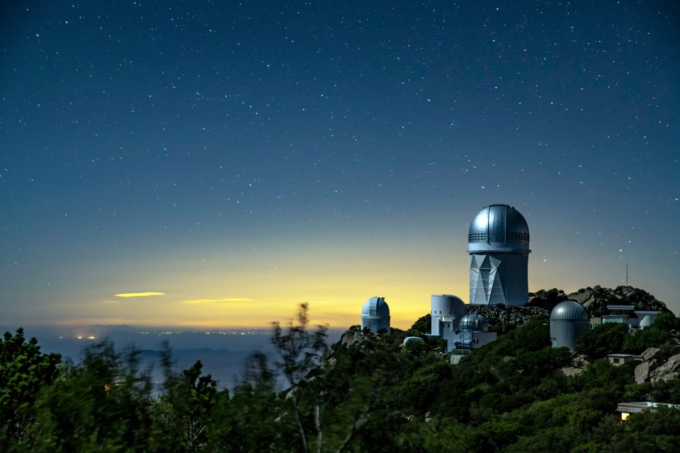 The Dark Energy Spectroscopic Instrument which sits on top of a huge telescope at Kitt Peak National Observatory in Arizona