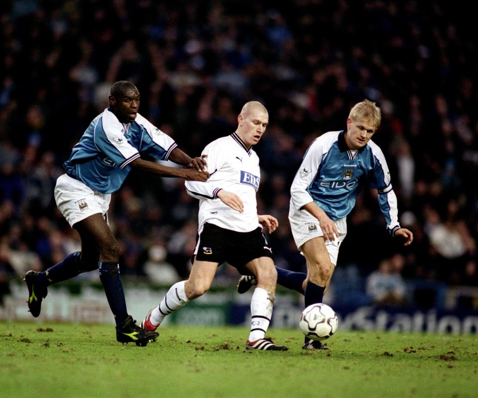 City’s Shaun Goater (left) and Alf Inge Haaland (right) sandwich Derby County’s Seth Johnson (centre) at Maine Road