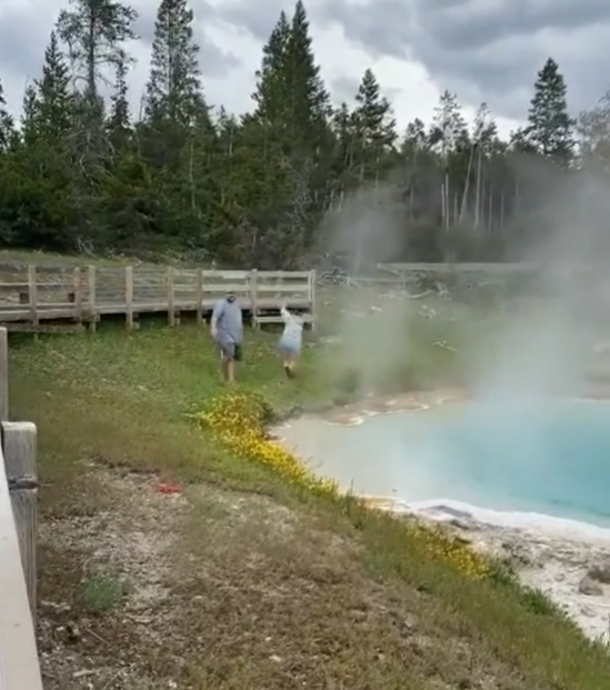 The mystery lady screams and wails after burning her hand in the roughly 80C temperatures