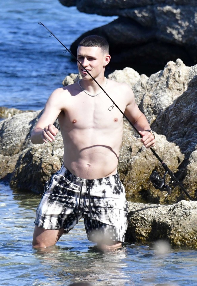 As his beach day continued, Phil turned his hand from footie to fishing