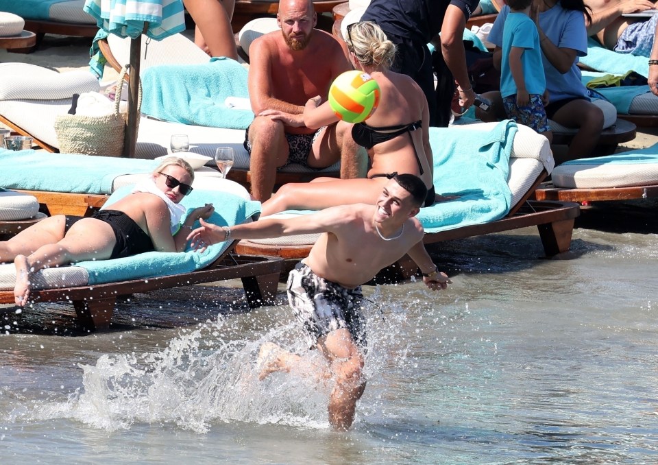 Phil Foden took a break from stardom to enjoy a day at Mykonos’ stunning Nammos beach with his partner Rebecca Cooke