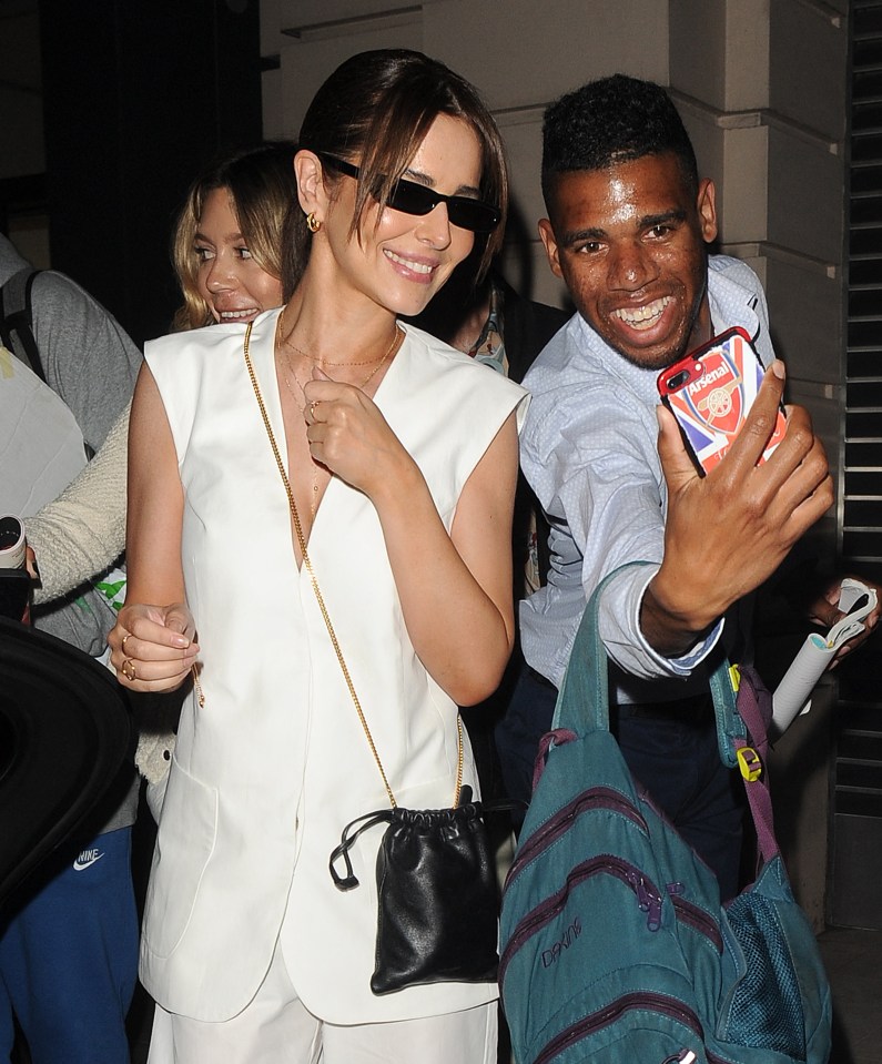 Cheryl beamed as she signed autographs for fans