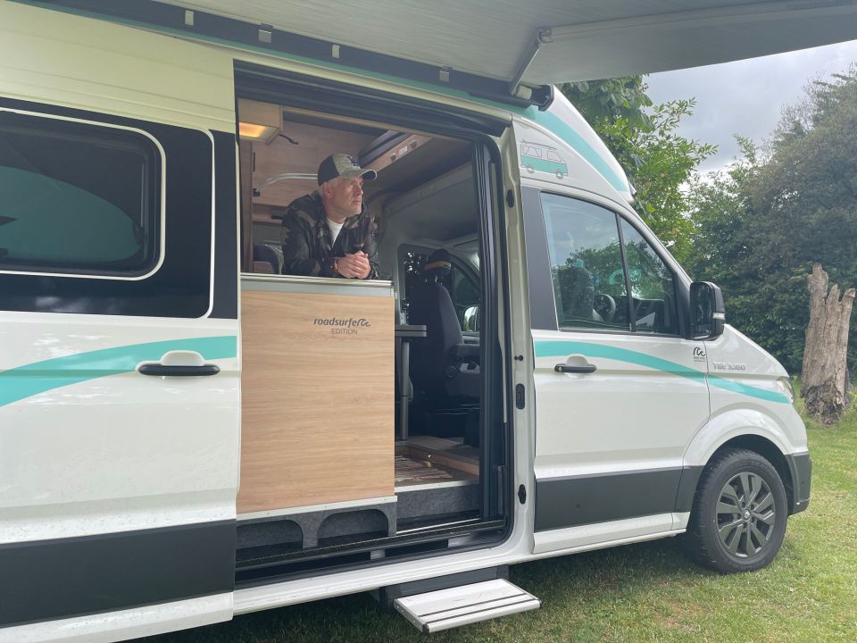 Chris was pictured in his camper after pitching up in a field to present the show