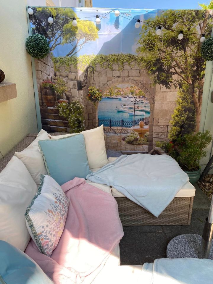 Nicky Perkins  transformed her garden into a Grecian paradise using a 3D shower curtain